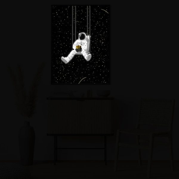Astronaut On the Swings bei Nacht beleuchtet