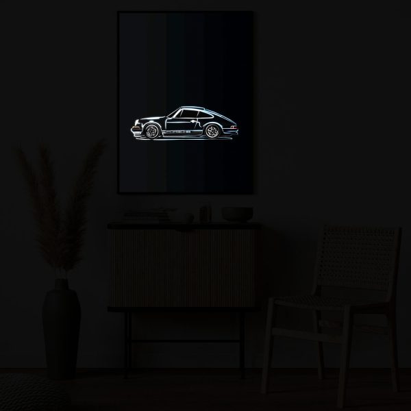 Classic Blue Porsche 911 illuminated at night