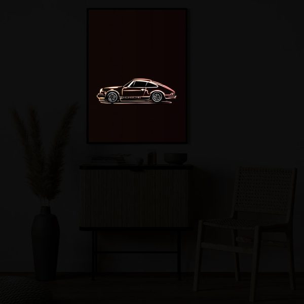 Classic Orange Porsche 911 illuminated at night