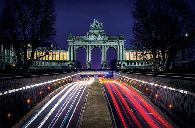 Brussels LED light canvas wall art glowing at night, featuring the Cinquantenaire arch with light trails