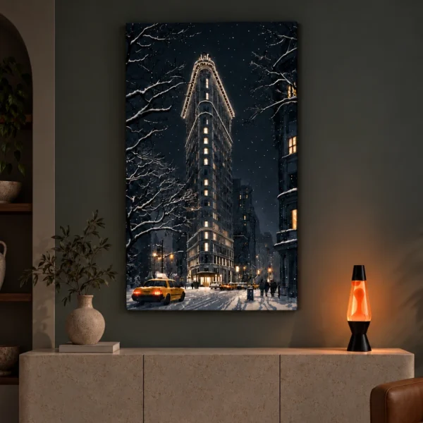Snowy Flatiron illuminated at night