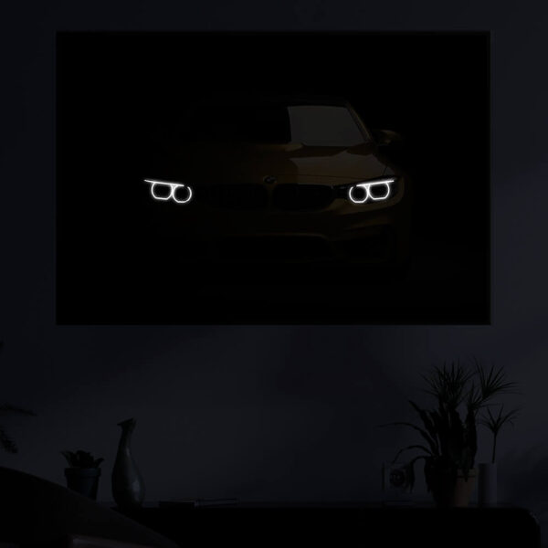 Golden BMW M3 illuminated at night